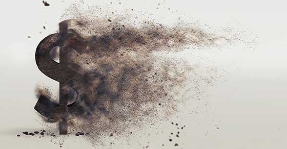 image of Dollar sign turning to dust and blowing away