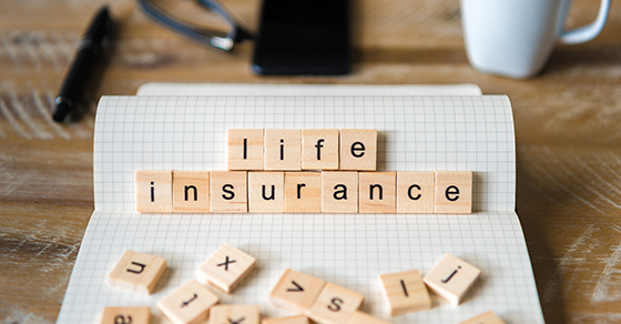 scrabble tiles spell out life insurance