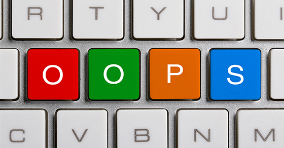 OOPS text on the colorful buttons of the keyboard.