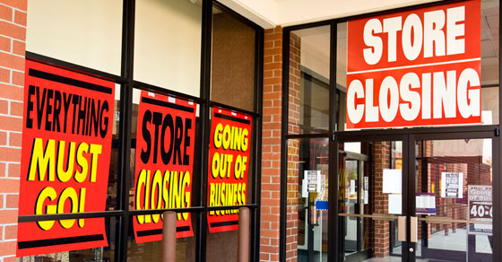Store with going out of business signs in the windows