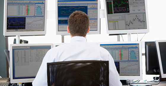 Mant watching investments on computers