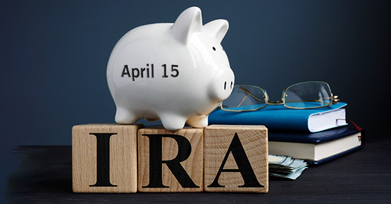 Piggy bank sitting on block spelling IRA