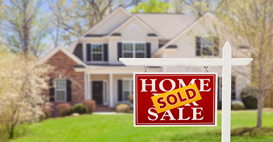Sold sign in front of a house