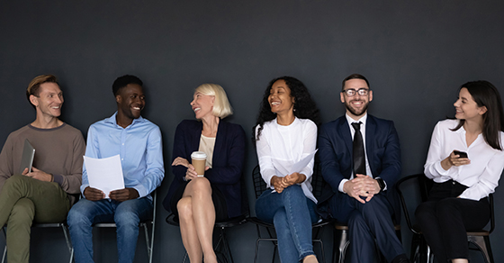 Employees sitting in a line