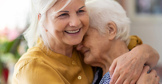 daughter hugging mother