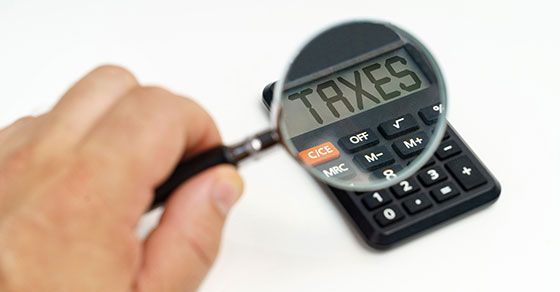 Magnifying glass over a calculator