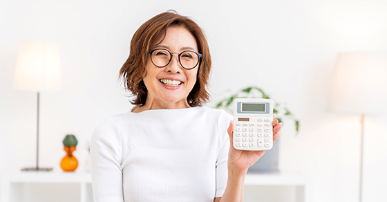 Woman holding a calculator