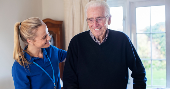 Home healthcare working helping man
